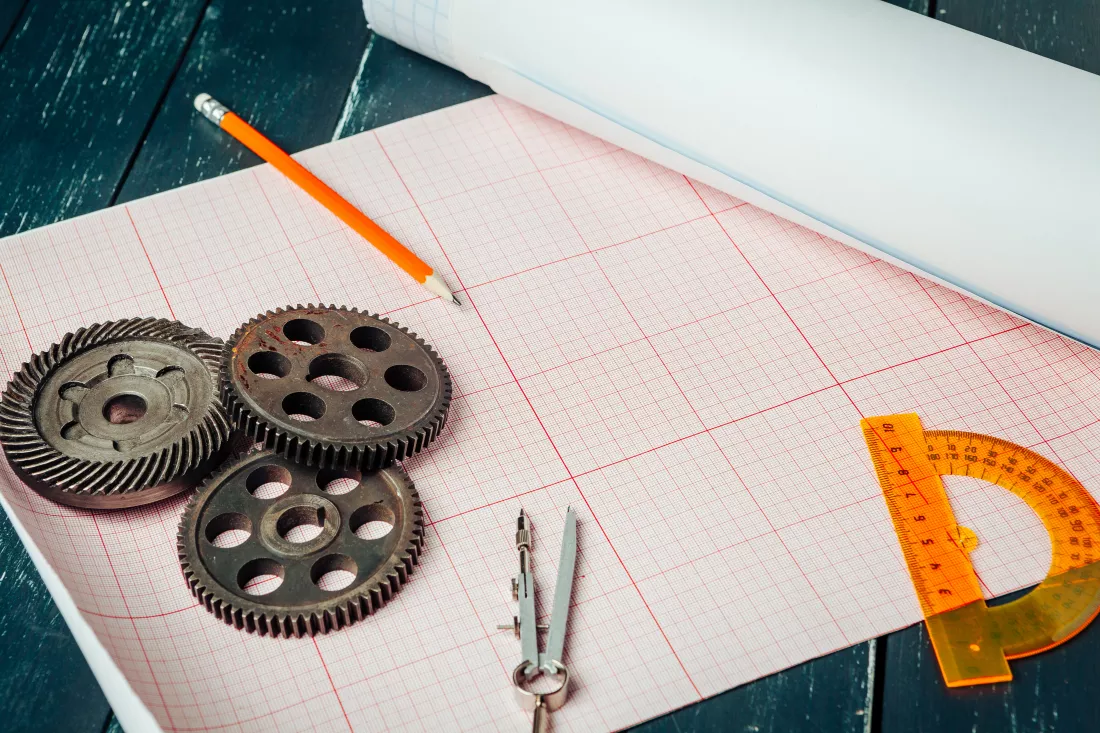 car-parts-graph-paper-close-up-engineering-concept