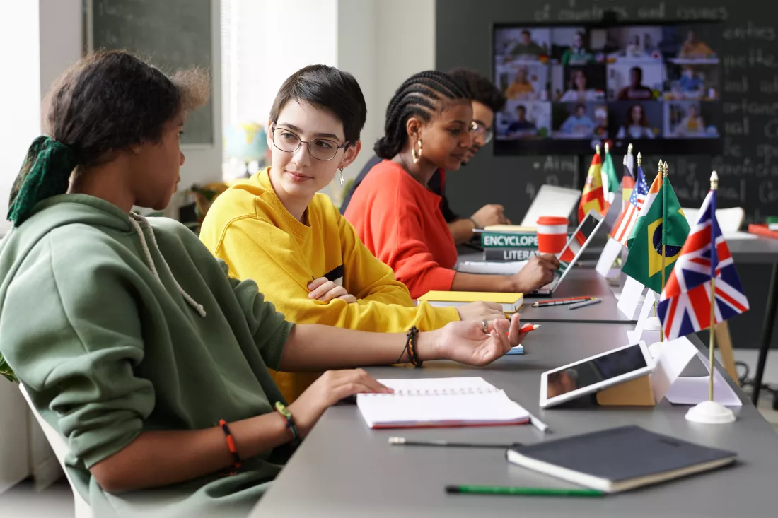 group-international-students-having-conference-classroom-they-sitting-table